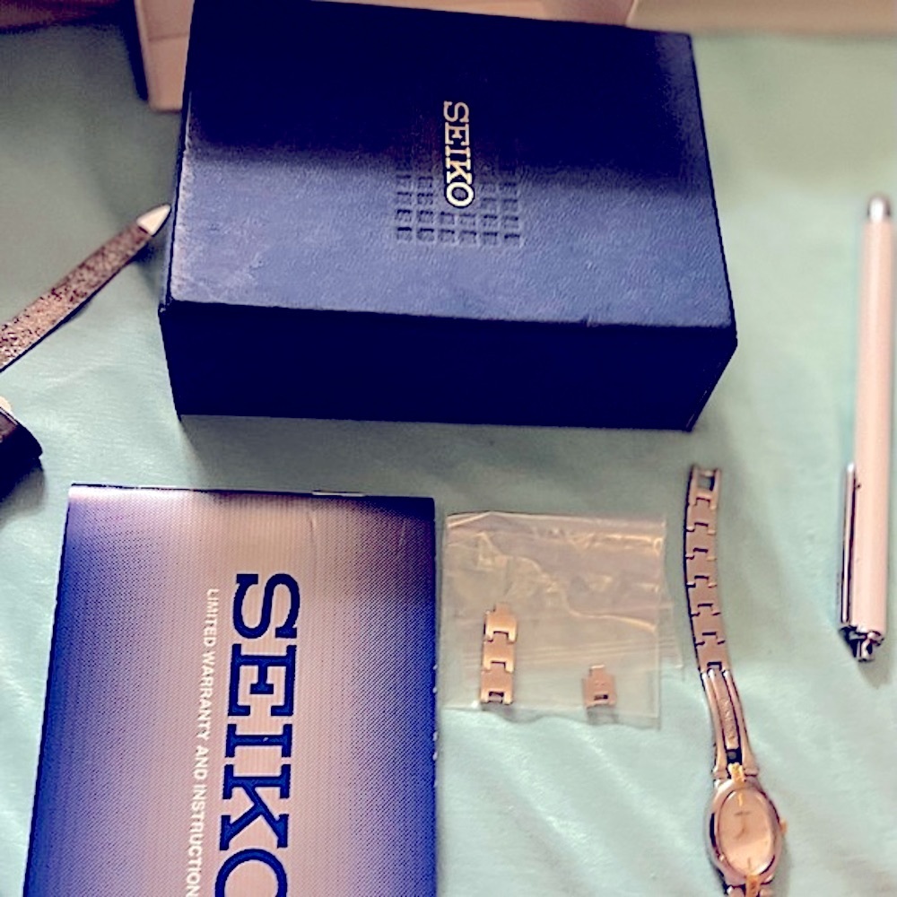 Seiko woman’s watch diamond on band and pearl face